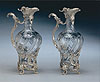 A pair of French silver mounted claret jugs